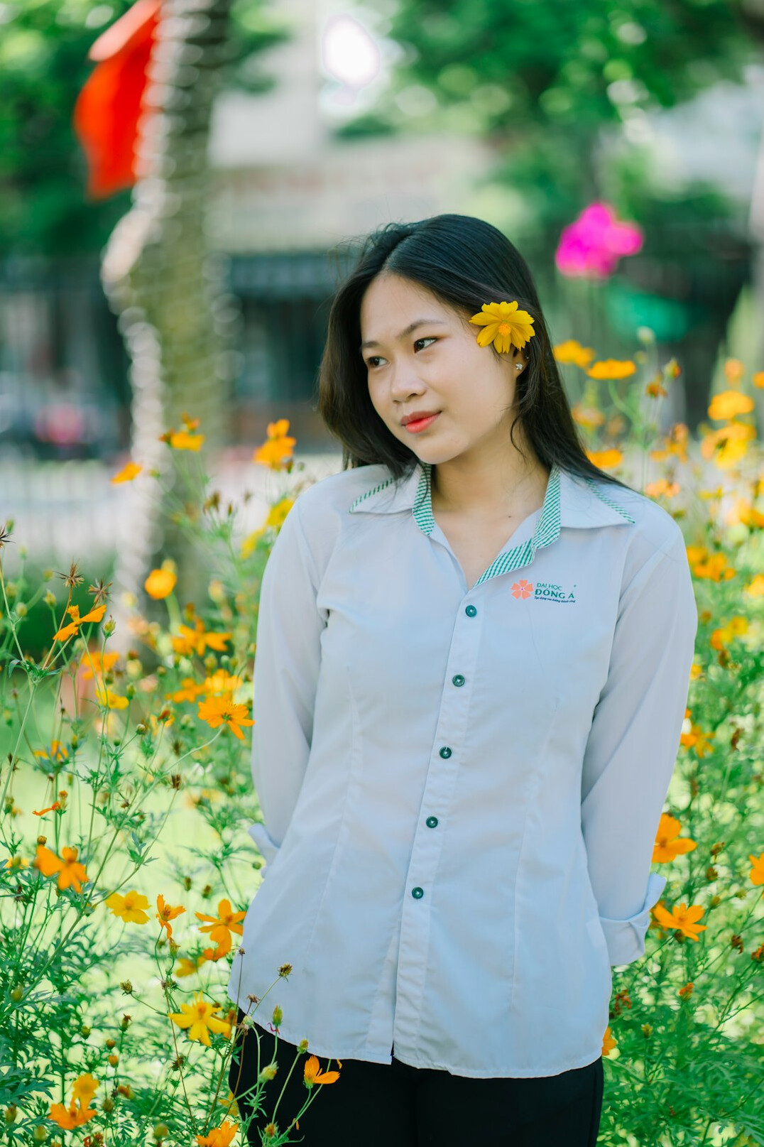 Portrait of a Croatian woman in her late twenties with long dark hair wearing a light shirt