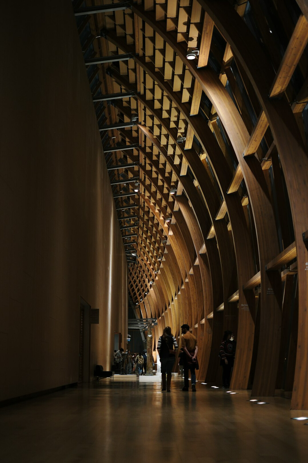 Group of Croatian healthcare colleagues walking through a bright corridor holding coffee and a tablet