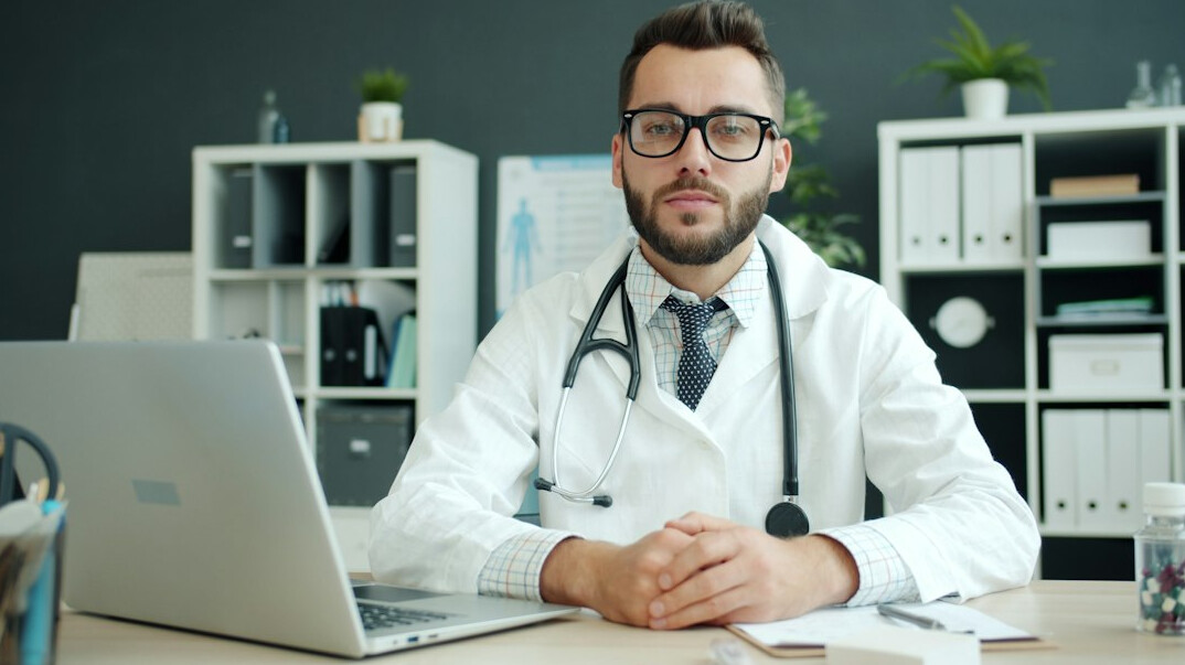 doctor using laptop for course